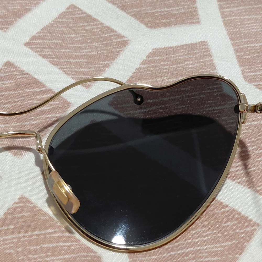 Miu Miu Gold Frame Sunglasses with Black Lenses